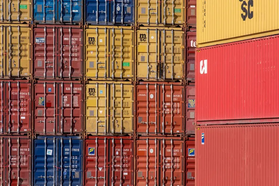 Stacked intermodal shipping containers at a commercial port terminal